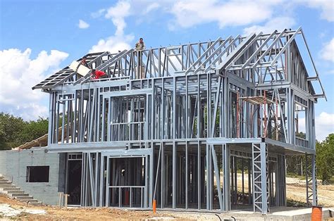 metal framework around a house being renovated|residential metal framing pros and cons.